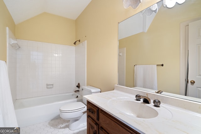 full bathroom with lofted ceiling, toilet, tile patterned floors, bathtub / shower combination, and vanity