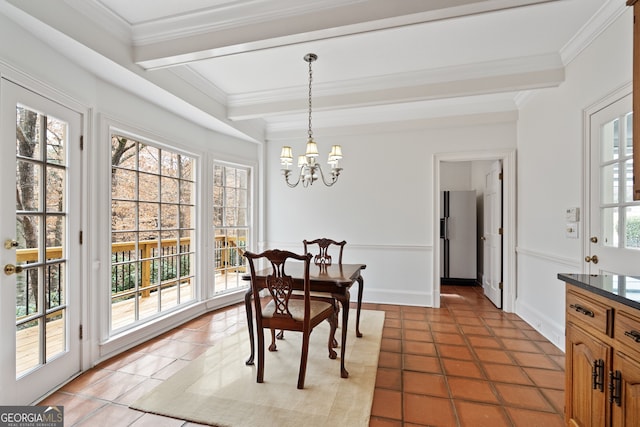 tiled dining space featuring ornamental molding, beam ceiling, and a notable chandelier