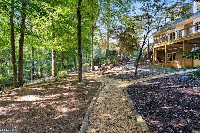 view of yard featuring a wooden deck