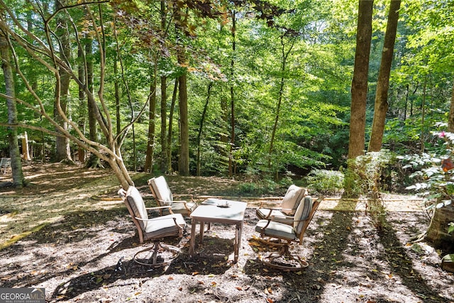 exterior space with a forest view