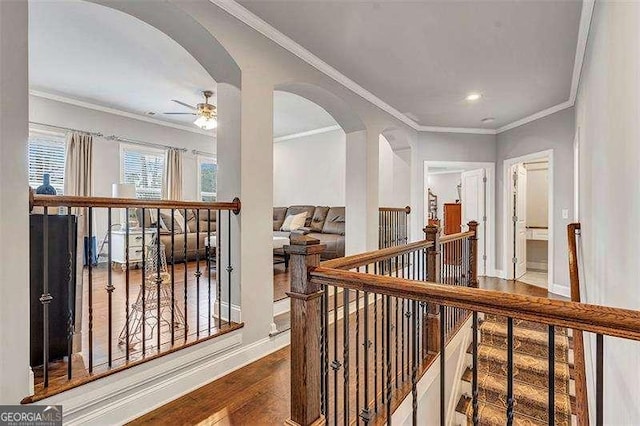 hall featuring crown molding and hardwood / wood-style floors