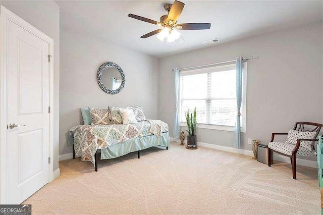 carpeted bedroom with ceiling fan