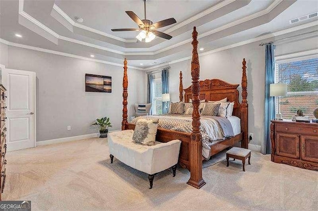 carpeted bedroom featuring ornamental molding, a raised ceiling, and ceiling fan