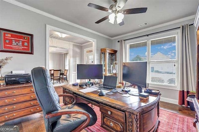 office featuring hardwood / wood-style flooring, ceiling fan, and crown molding