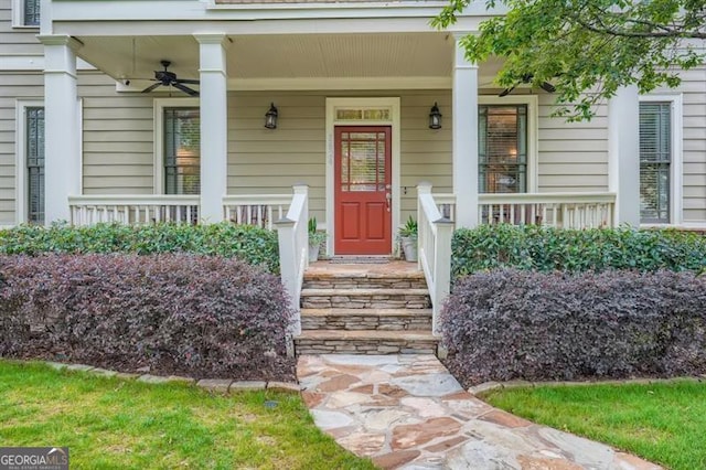 doorway to property with a porch and ceiling fan