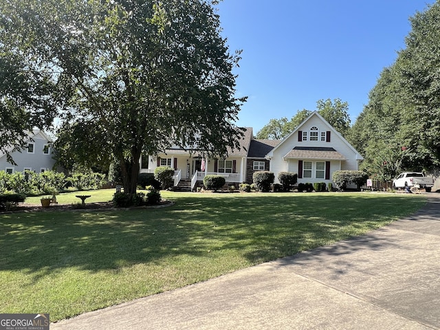 view of front of home featuring a porch and a front lawn