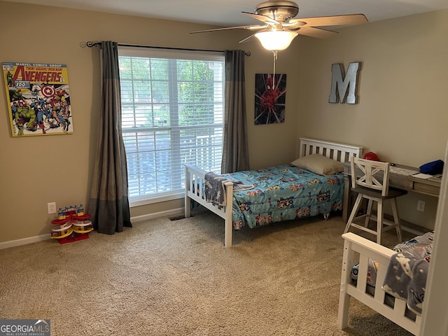 bedroom with carpet floors, ceiling fan, and baseboards