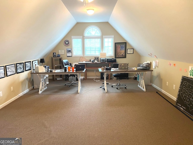 home office featuring lofted ceiling and baseboards