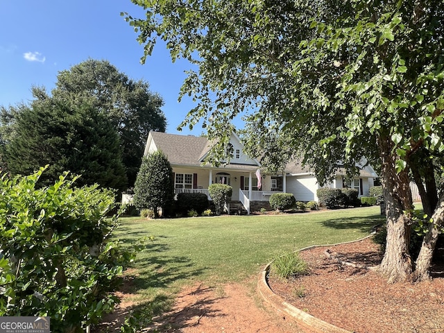 view of front of property featuring covered porch and a front yard