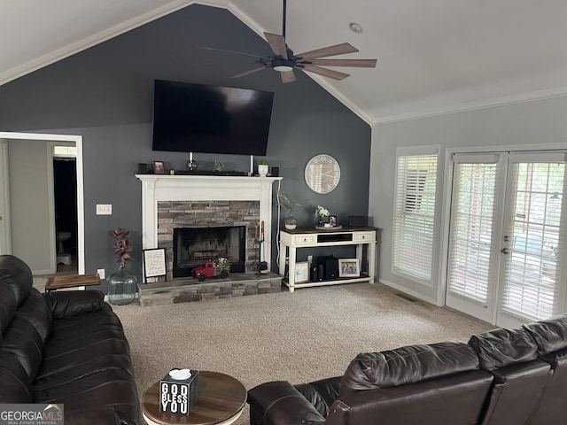 carpeted living room with lofted ceiling, ceiling fan, and a fireplace