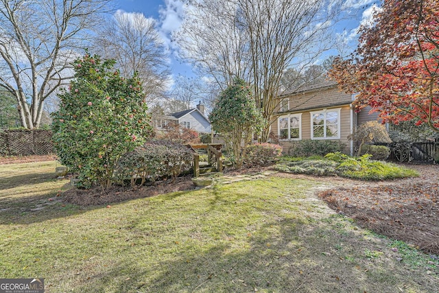 view of yard with fence