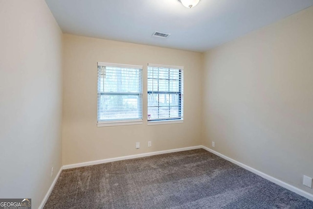 spare room featuring carpet flooring