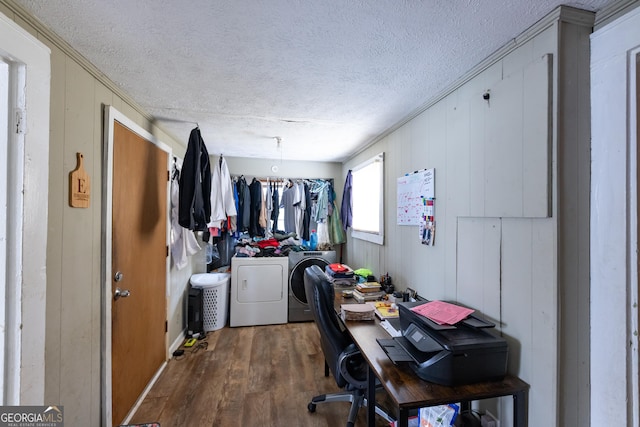 office featuring independent washer and dryer, dark hardwood / wood-style flooring, and a textured ceiling