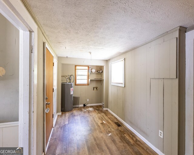 bedroom featuring dark hardwood / wood-style flooring, crown molding, and a textured ceiling