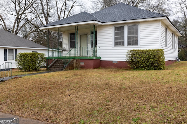 view of front of home featuring a porch and a front lawn