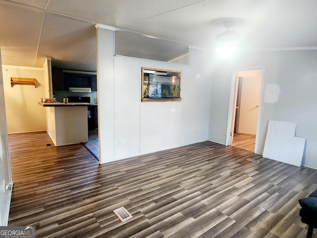 interior space with dark wood-style floors and crown molding