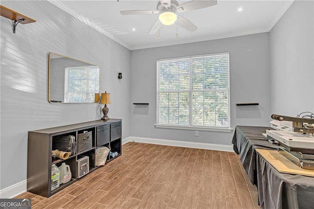 office space featuring crown molding, ceiling fan, and hardwood / wood-style flooring