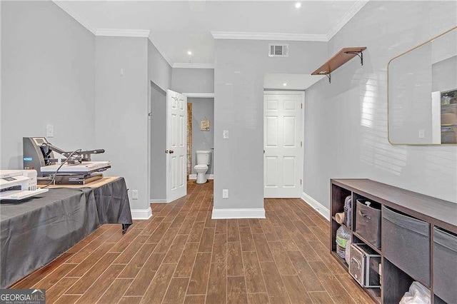 interior space featuring crown molding and dark hardwood / wood-style floors