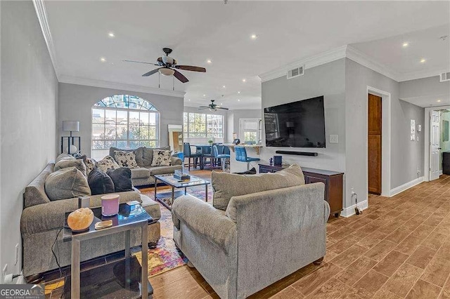 living room with hardwood / wood-style flooring and ornamental molding