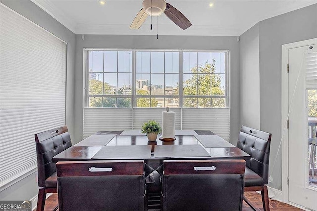 dining room featuring ornamental molding and ceiling fan