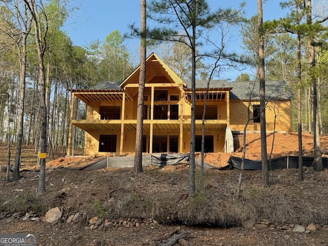 back of house featuring a deck