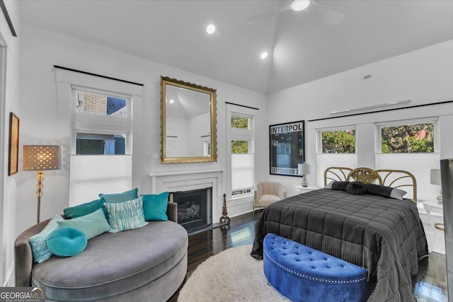 bedroom featuring dark wood-type flooring, ceiling fan, and vaulted ceiling