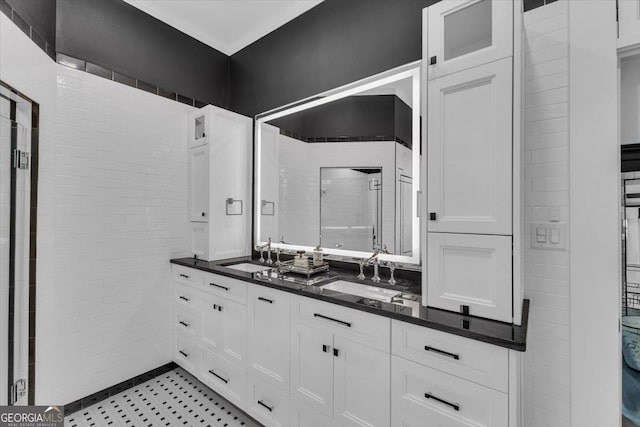 bathroom featuring vanity and a shower