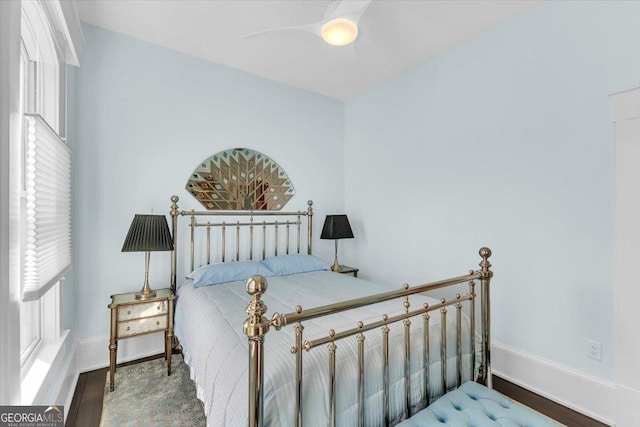 bedroom featuring hardwood / wood-style floors and ceiling fan