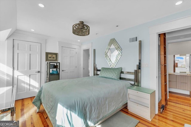 bedroom featuring hardwood / wood-style floors