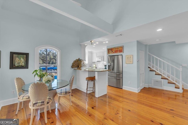 dining space featuring light hardwood / wood-style floors