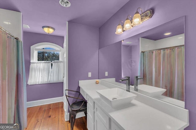 bathroom with vanity and wood-type flooring