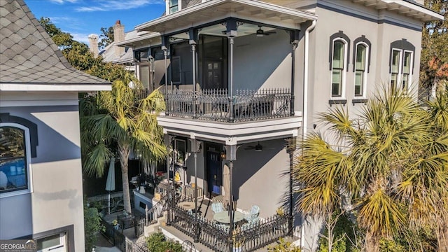 rear view of house with a balcony