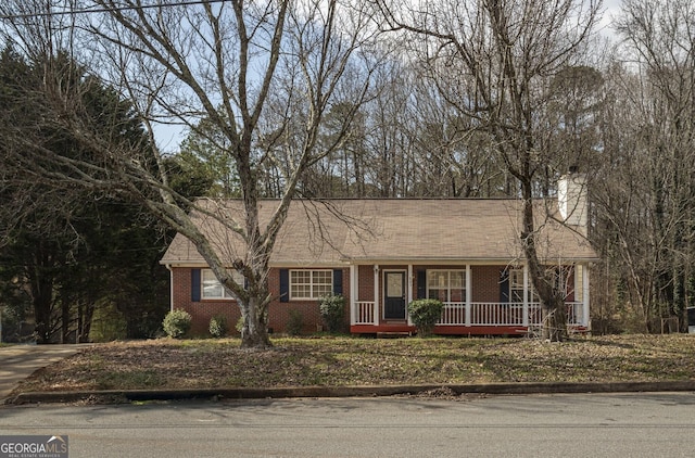 single story home featuring covered porch