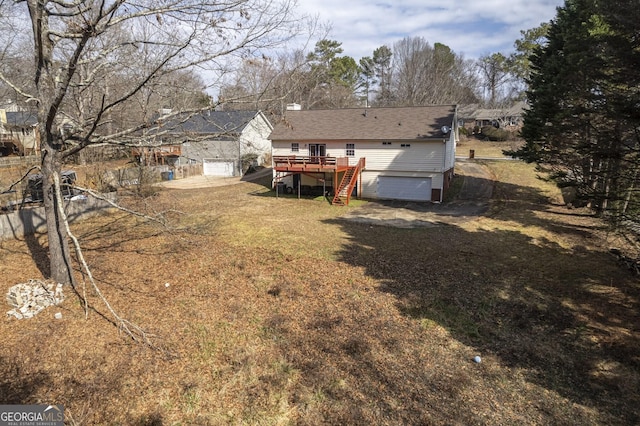 back of property with a wooden deck