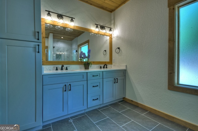 bathroom with vanity and tile patterned floors