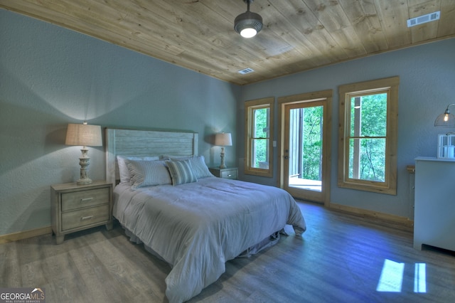 bedroom with access to exterior, wood ceiling, and light hardwood / wood-style flooring