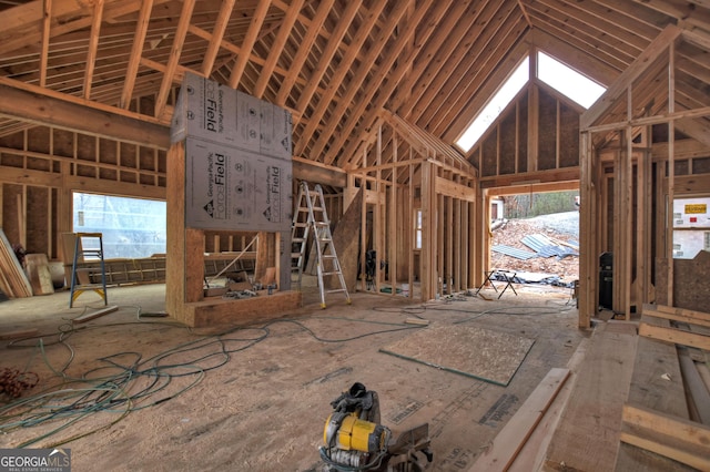 miscellaneous room with plenty of natural light and high vaulted ceiling