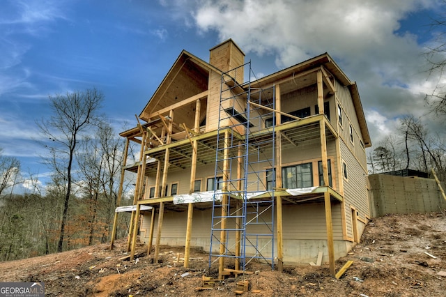 back of property with a balcony