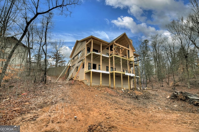 rear view of house featuring a balcony