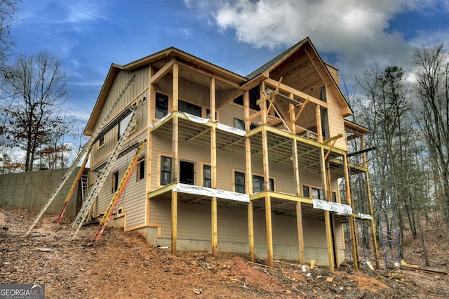 back of property featuring a balcony