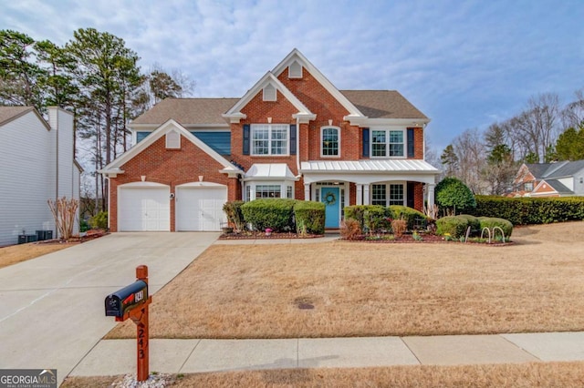 view of front facade featuring a garage and a front lawn