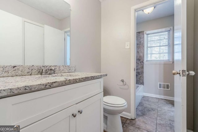 full bathroom with tile patterned flooring, vanity, shower / washtub combination, and toilet