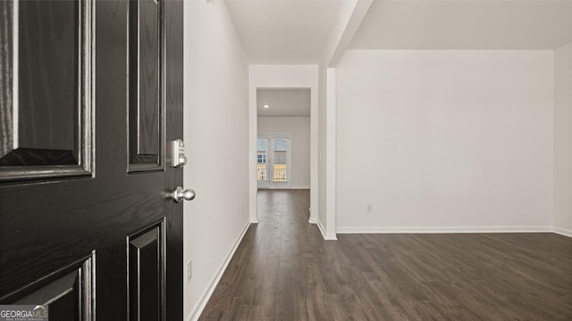 foyer with dark hardwood / wood-style flooring