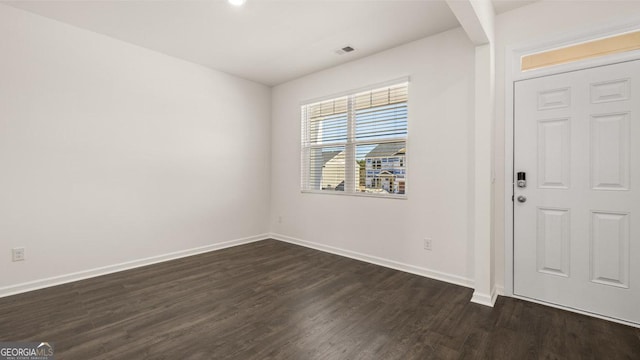 foyer entrance with dark hardwood / wood-style flooring