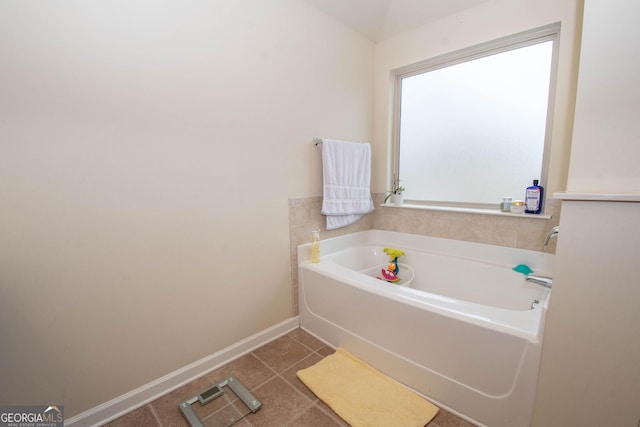 bathroom featuring tile patterned floors and a bathing tub