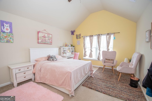 carpeted bedroom with lofted ceiling