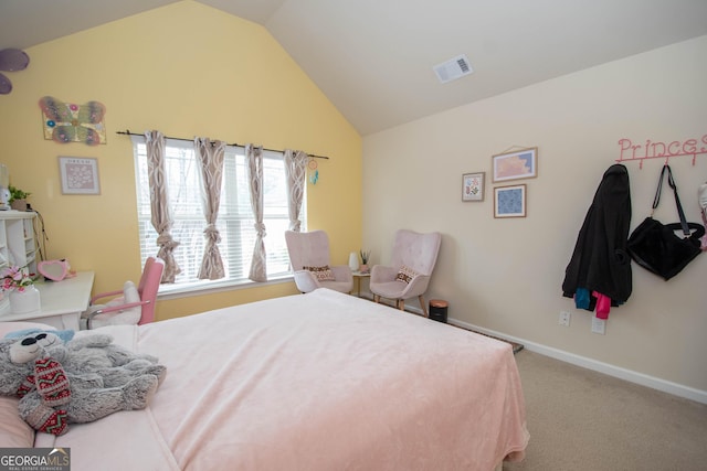 carpeted bedroom with lofted ceiling