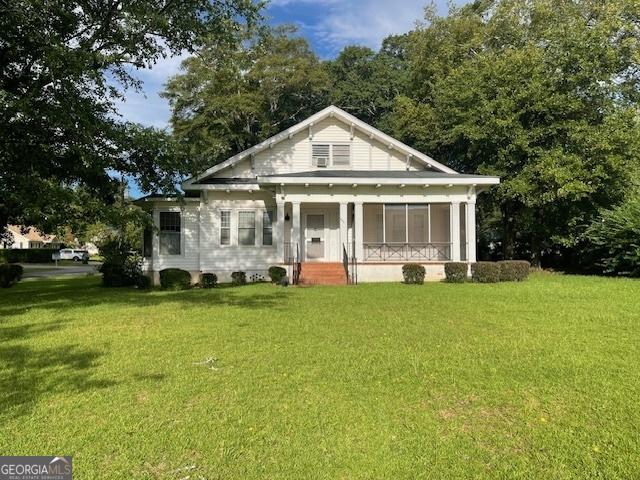 greek revival house featuring a front lawn