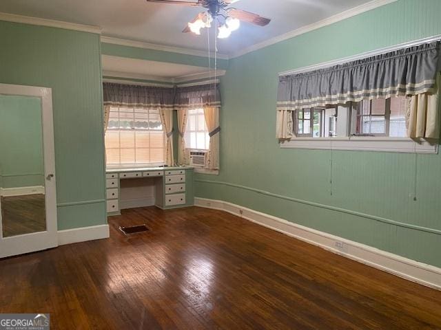 unfurnished bedroom with ornamental molding, wood finished floors, visible vents, and baseboards