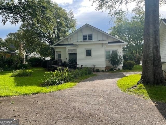 exterior space with a yard and driveway